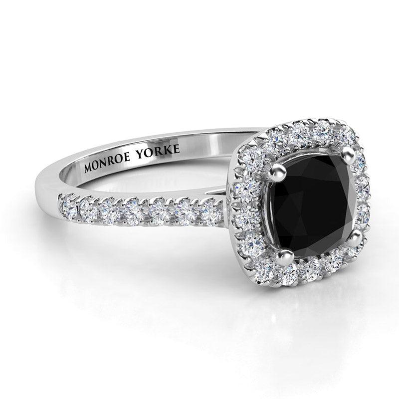 Black diamond ring with white halo. Cushion cut centre diamond