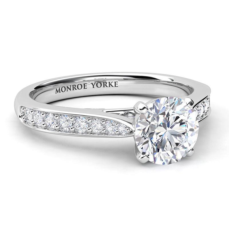 Denver round diamond engagement ring. Diamond set band that tapers into the centre setting. 18ct white gold