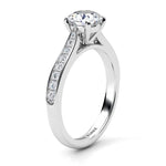 Denver in platinum, side view - Four claw round brilliant cut centre diamond and diamonds on the tapering sweep up band. 