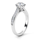 Denver in platinum, side view - Four claw round brilliant cut centre diamond and diamonds on the tapering sweep up band. 