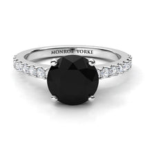 Desir Black Diamond Engagement Ring with white diamonds on the band. White gold or platinum