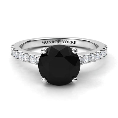 Desir Black Diamond Engagement Ring with white diamonds on the band. White gold or platinum