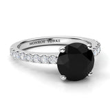 Desir Black Diamond Engagement Ring with white diamonds on the band. White gold or platinum. Side view