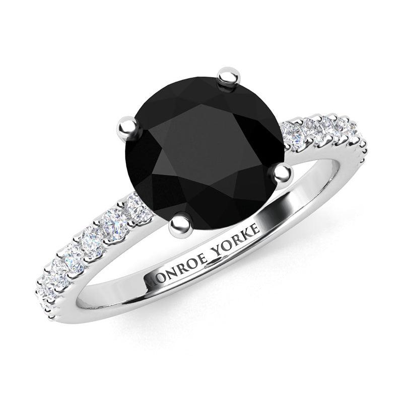 Desir - Black diamond ring in platinum.  Centre round black diamond 1.70 carats. Centre diamond in a 4 claw setting