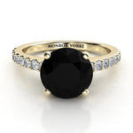 Desir - Gold black diamond ring - Front View. 1.50 carat round black diamond centre . White diamonds down the band.  