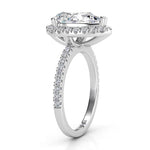 Side view: Showing the beautiful centre halo setting and diamond set band, created in platinum. 