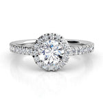 Ecco in platinum - round diamond halo ring with a low centre setting. 