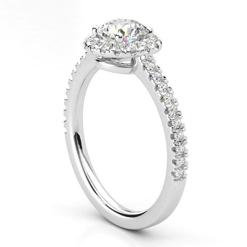 Ecco - round diamond halo ring with a low centre setting. Side view showing diamonds on the band. 18ct white gold 