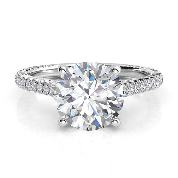 Elsie - Front view - unique diamond ring in white gold.  Centre GIA certified round diamond with pave set diamonds on three sides of the band