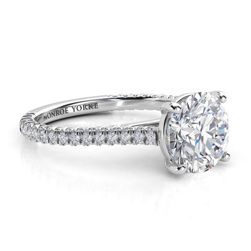 Elsie - side view - unique and beautiful design, showing the diamond set to three sides of the band.  Centre 4 claw setting.  Platinum ring — view 3