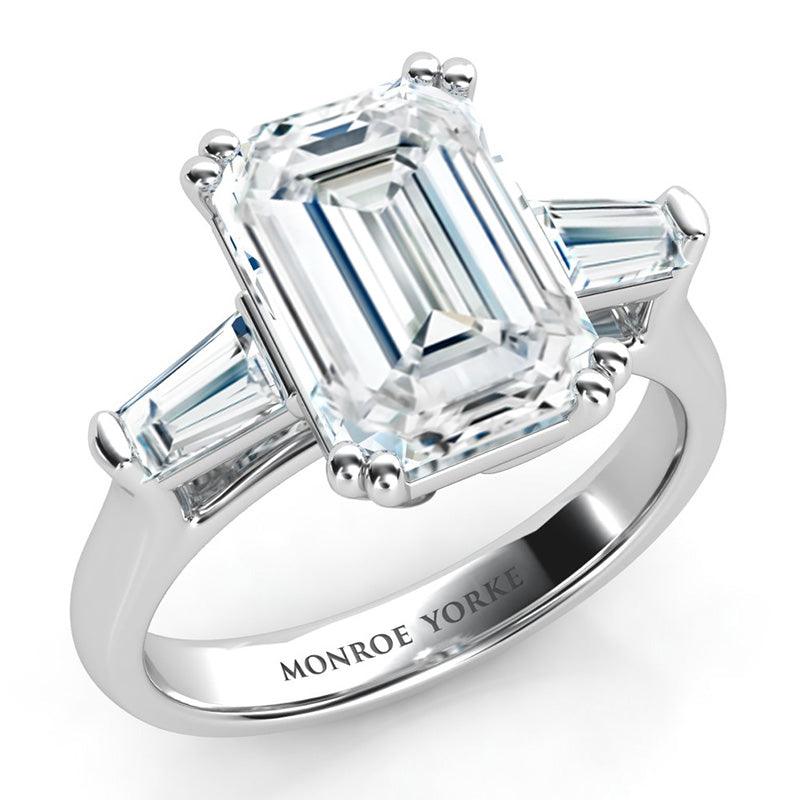 Envy - GIA certified emerald and tapered baguette trilogy ring.  Emerald cut diamond held securely in double claws. 18ct white gold. 