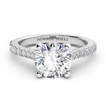 Enya - GIA certified round diamond engagement ring in a 4 claw setting with diamonds on the sweep up band. 18ct white gold