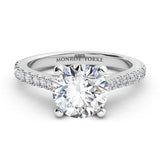 Enya - GIA certified round diamond engagement ring in a 4 claw setting with diamonds on the sweep up band. 18ct white gold