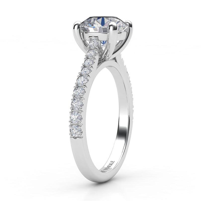 Enya in platinum.  Round diamond engagement ring.  Side view 2, showing the beautiful centre setting and diamond set band. 