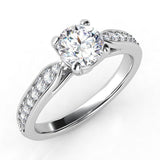 Felice in platinum - Round Diamond ring with diamonds on the shoulders. Centre 4 claw setting.