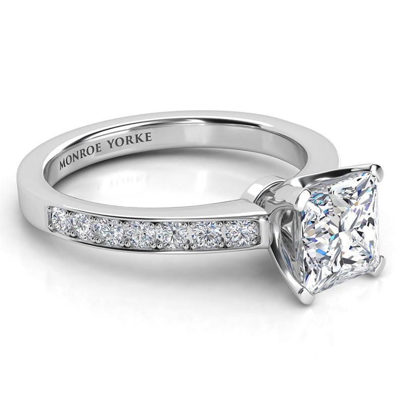 Fifth Avenue - Side view showing princess cut diamond in a beautiful setting.  with pave set round diamonds on the band. Platinum band and setting — view 3