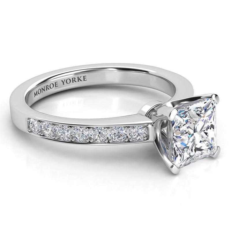 Fifth Avenue princess cut diamond engagement ring. Side view showing the beautiful set side diamonds