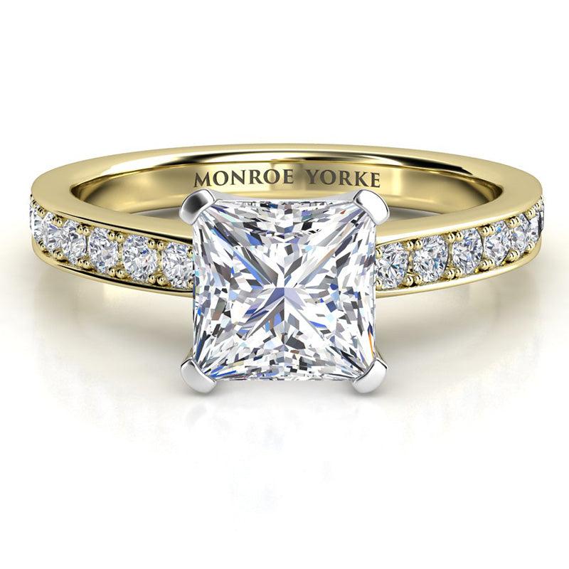 Fifth Avenue Princess Cut Diamond Engagement Ring in Yellow Gold.  Round diamonds on the sweep up band