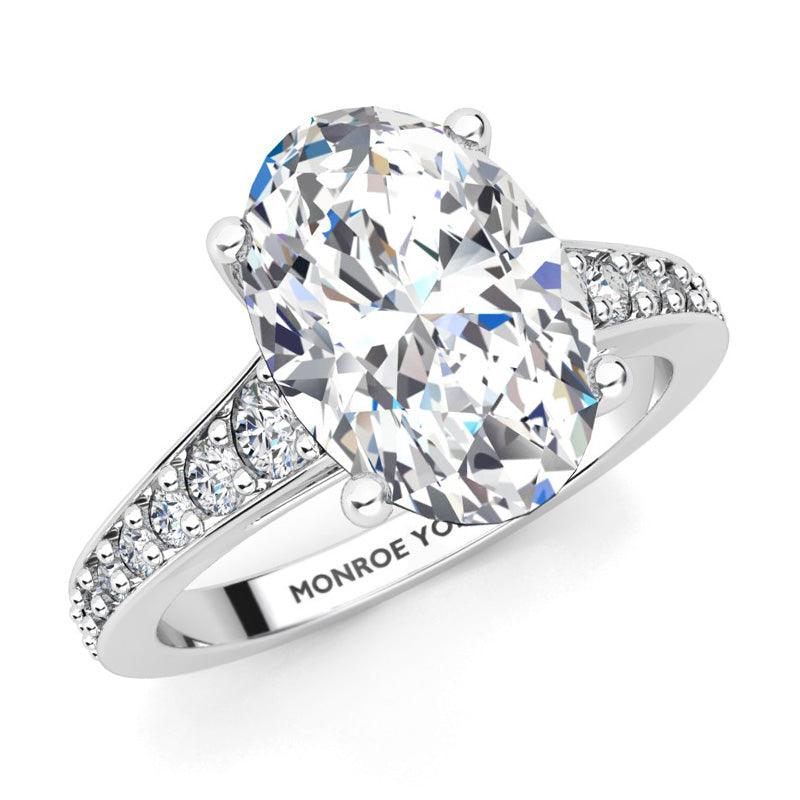 Finley engagement ring in white gold.  Centre premium oval cut diamonds.  Graduated band with diamonds