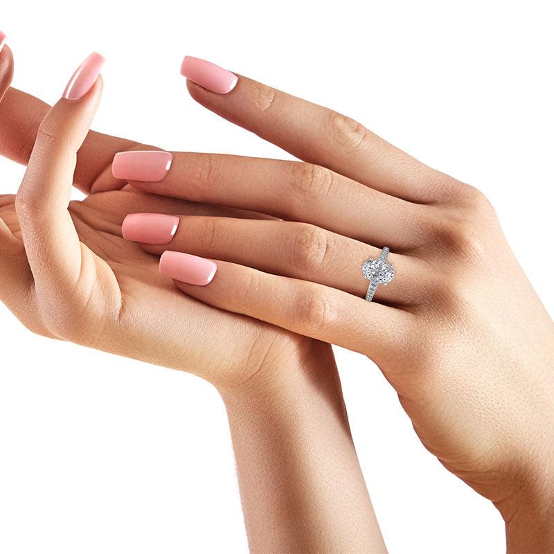 Finley oval shaped diamond engagement ring on a hand