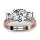 Forever - Top view. 18ct Rose Gold Diamond Trilogy, Three Stone Ring.  Rose gold band and white gold centre setting.  Diamonds set on the sweep up band. 