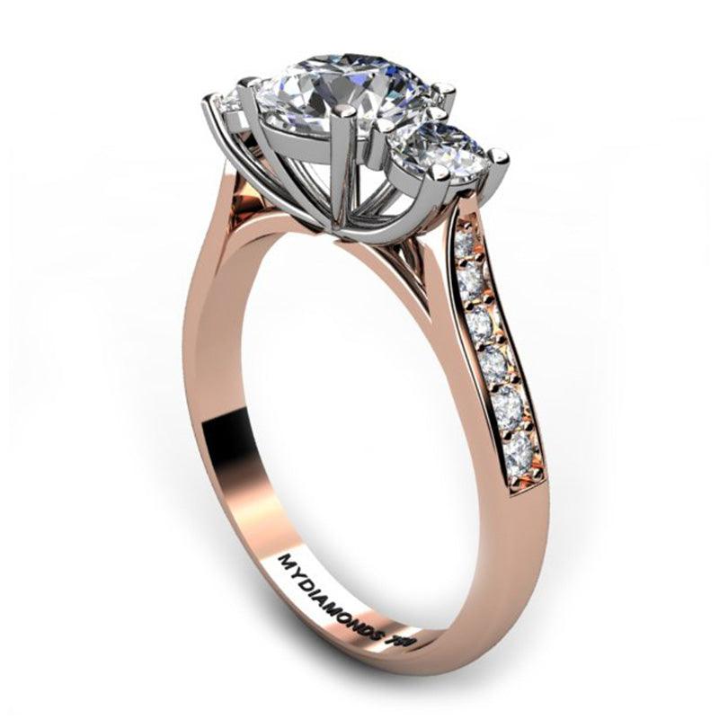 Forever - 18ct Rose Gold Diamond Trilogy, Three Stone Ring.    Side view showing beautiful centre basket setting and diamonds on the sweep up band. 