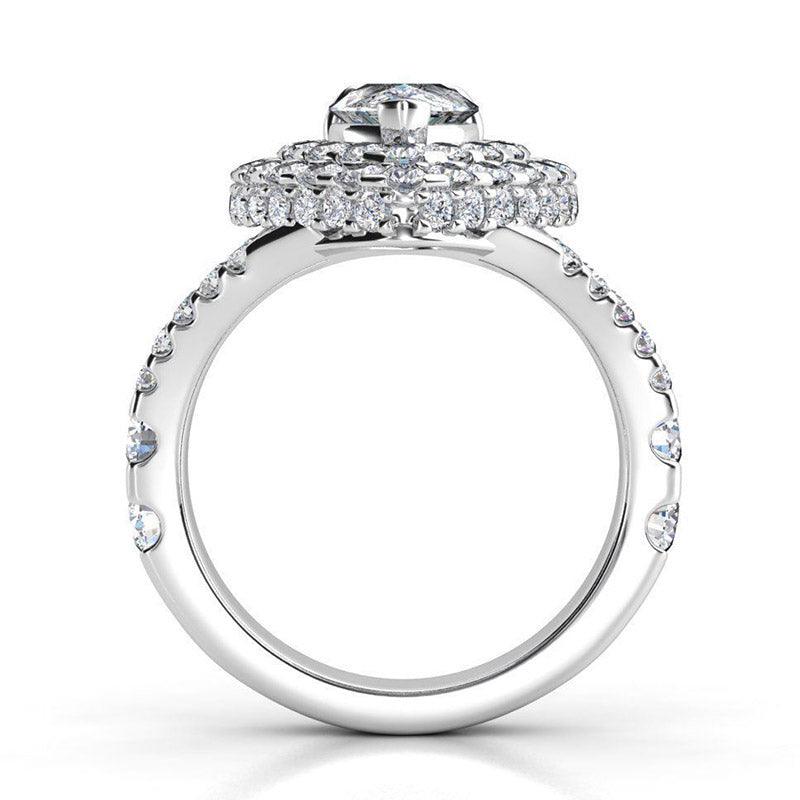 Gilana - Pear cut diamond, double halo ring. Side view, showing the diamonds set to the side of the halo 