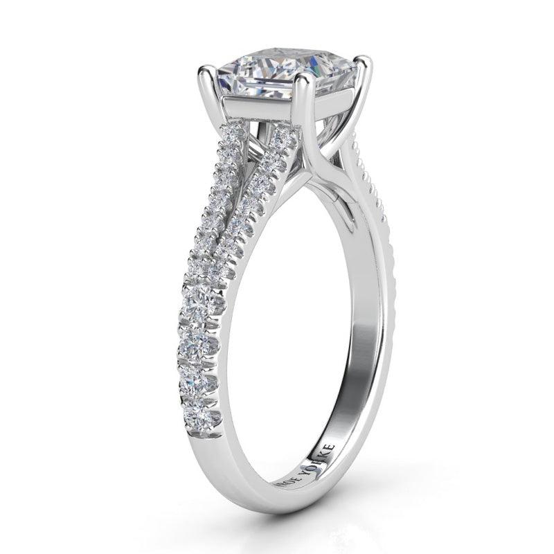 Gemma - Platinum princess cut diamond engagement ring.  Side view 2 showing split band and cross over centre setting