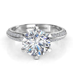 Juliet in platinum.  Front view. 6-calw centre setting with a GIA certified round diamond. Two rows of pave set diamonds on the band