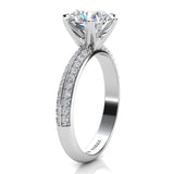 Juliet White Gold.  Round diamond engagement Ring. Side view showing beautiful 6-claw centre setting and pave set diamonds on the band