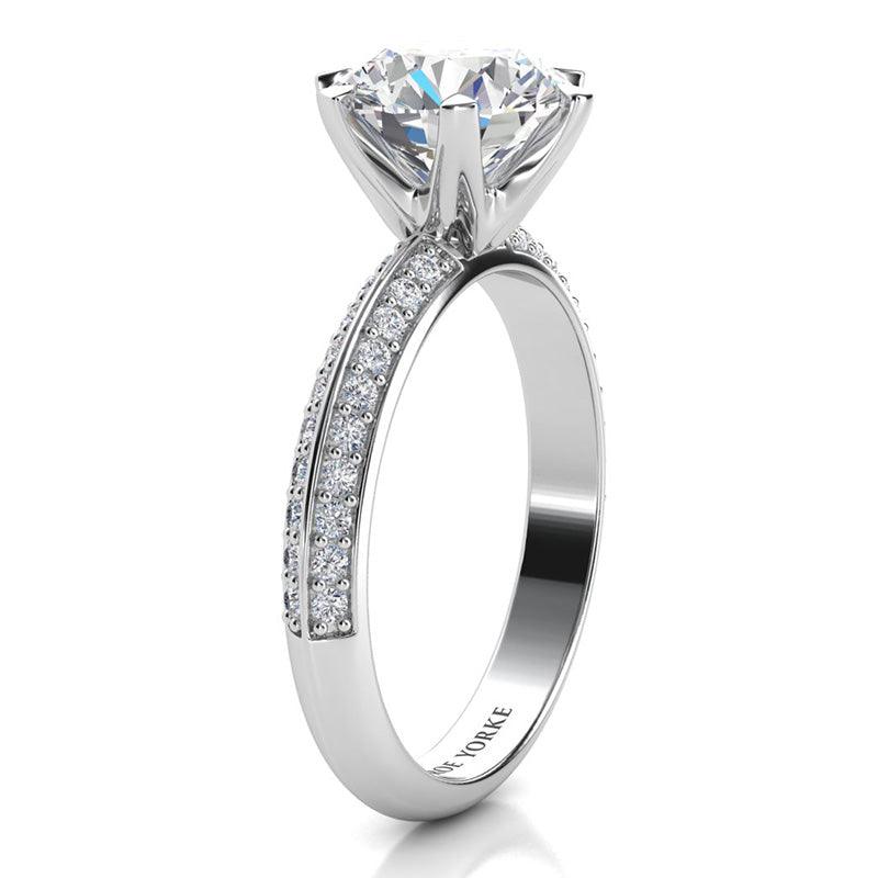 Juliet White Gold.  Round diamond engagement Ring. Side view showing beautiful 6-claw centre setting and pave set diamonds on the band