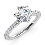 June - White gold, six claw centre setting with diamonds on the band.  Centre GIA certified round diamond. 
