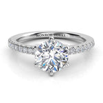 Six claw diamond ring. Diamond engagement ring with side diamonds. Centre diamond in a six claw setting. 