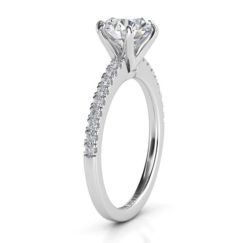 June round brilliant cut diamond engagement ring in platinum, side view