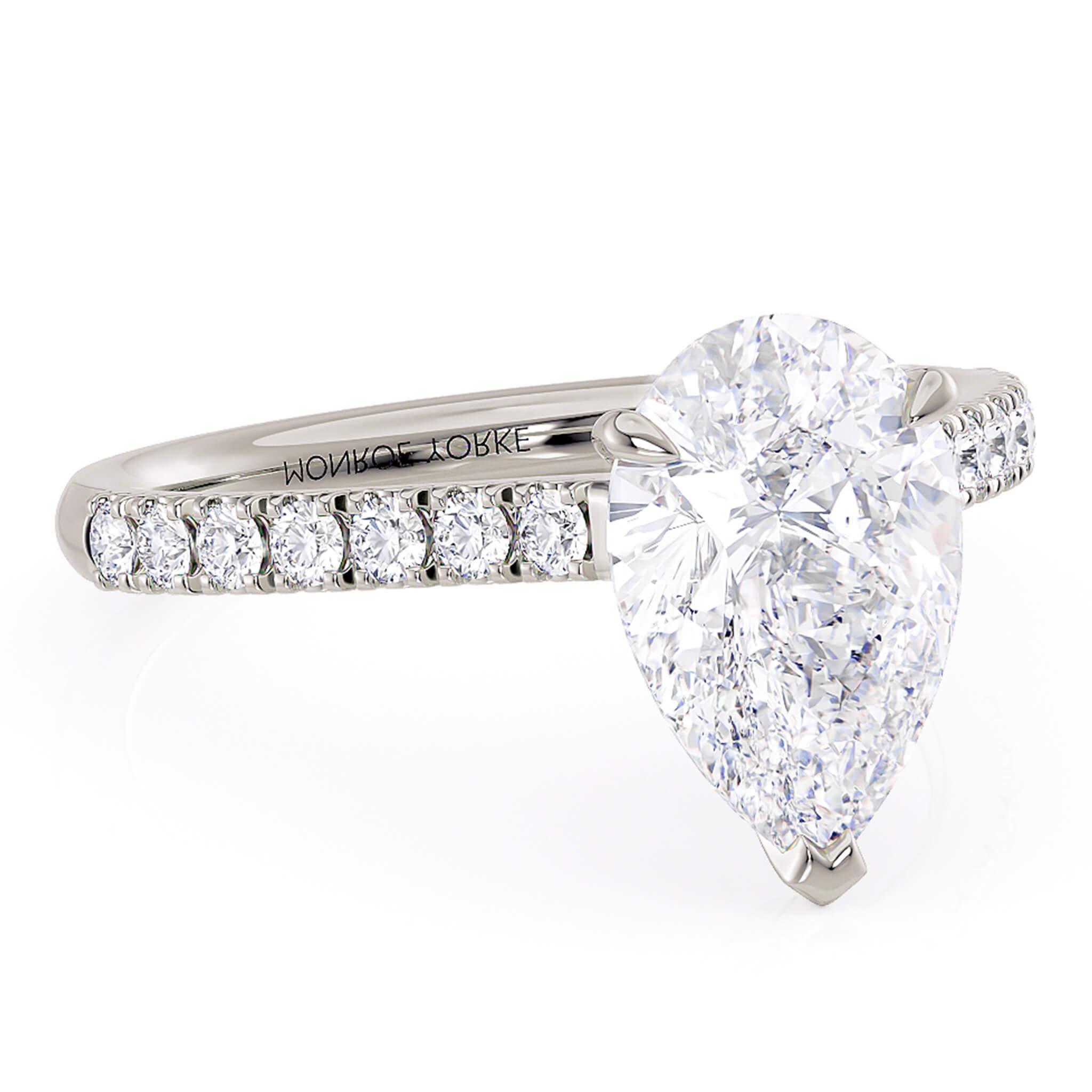 Karly pear / tear drop diamond engagement ring.  Diamonds on the band. Centre 3 claw setting.  18ct white gold or platinum