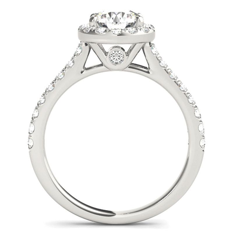Lana in platinum - round diamond halo engagement ring, side view showing diamond highlights under the centre setting.