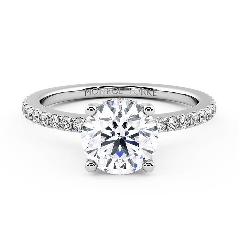 Liliana - Round diamond engagement ring with a hidden halo and diamonds on the band.  18ct white gold or platinum