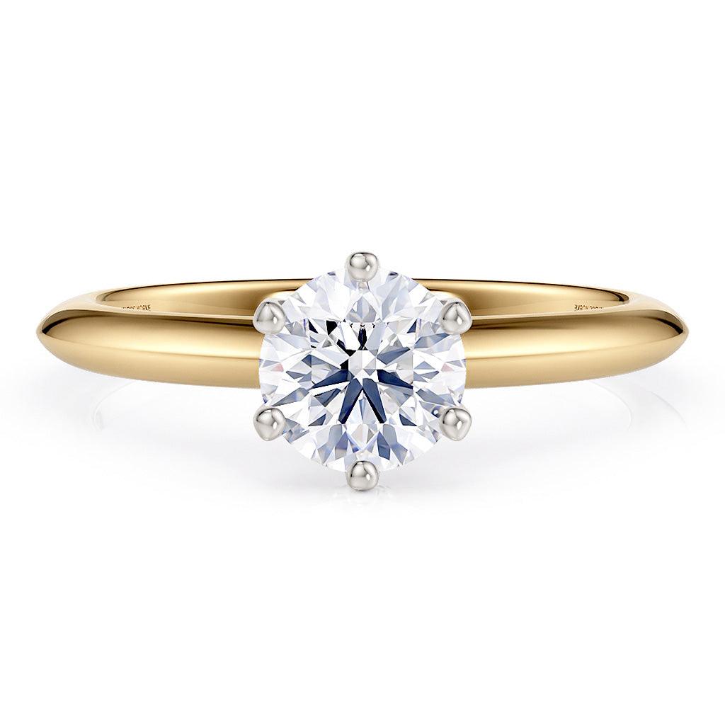 Love - solitaire ring with a lab grown diamond.  Gold band.  Centre diamond in a 6 claw setting. 