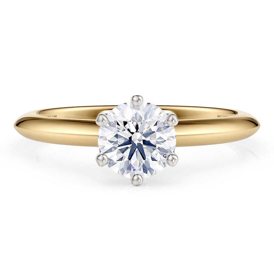Love - solitaire ring with a lab grown diamond.  Gold band.  Centre diamond in a 6 claw setting. 