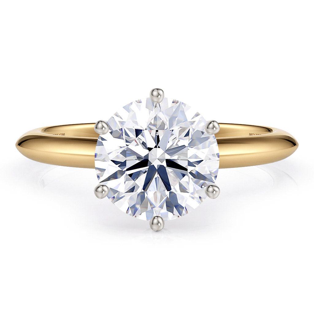 2.00 carat round lab created diamond ring in a yellow gold knife edge band