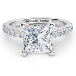 Princess cut diamond engagement ring with diamonds on the band. Lutece in platinum. 