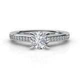 May in platinum - engagement ring with centre round diamond and diamonds on the band. 