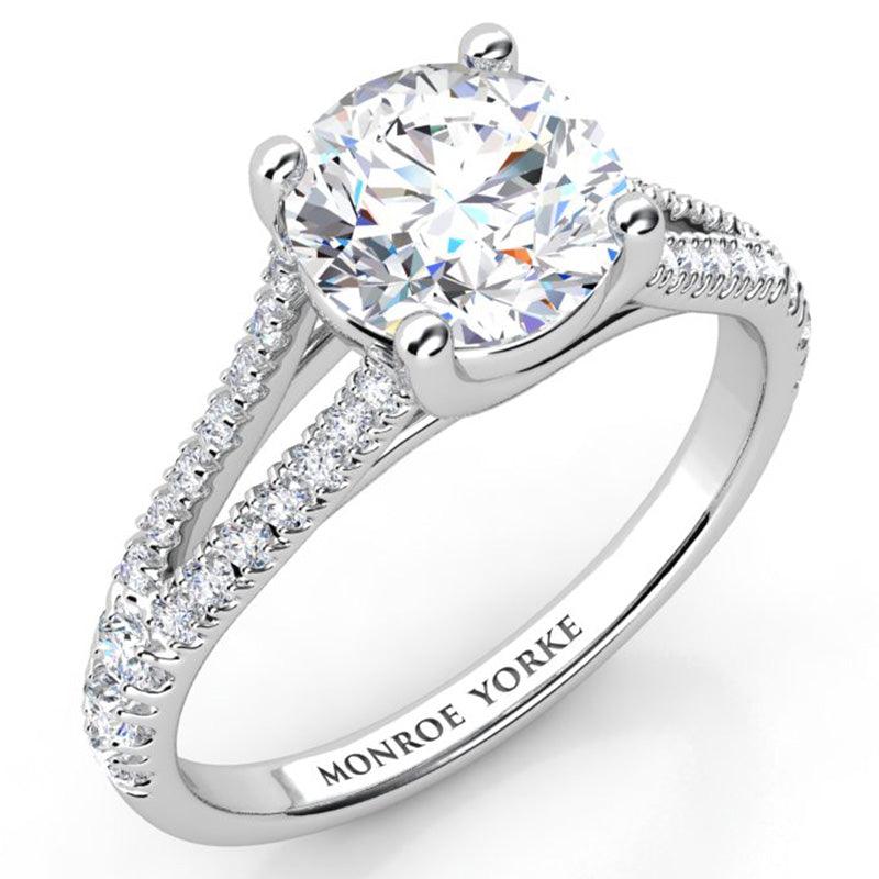 Cora in platinum. Split band diamond engagement ring with diamond set band. 