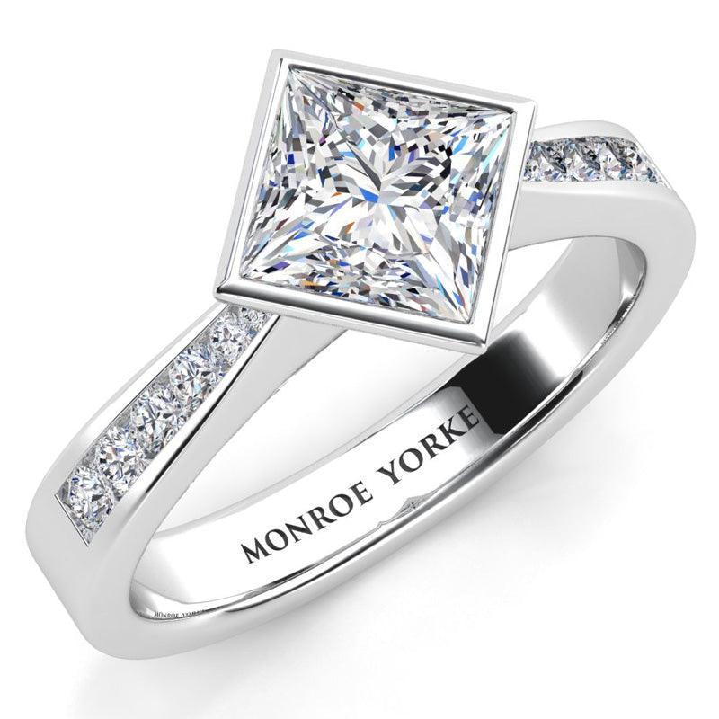 Nash - Rub-over Bezel Set Princess Cut Diamond Engagement Ring. Centre diamond set at a 45 degree angle. White gold. 