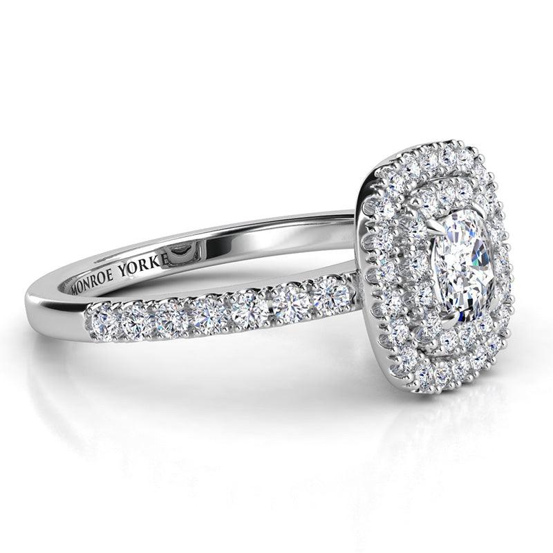 Cushion cut diamond double halo engagement ring in platinum.  Side view showing the intricate detail