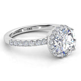 Orion in platinum: Halo engagement ring. Unique design with halo set under the girdle of main diamond. 