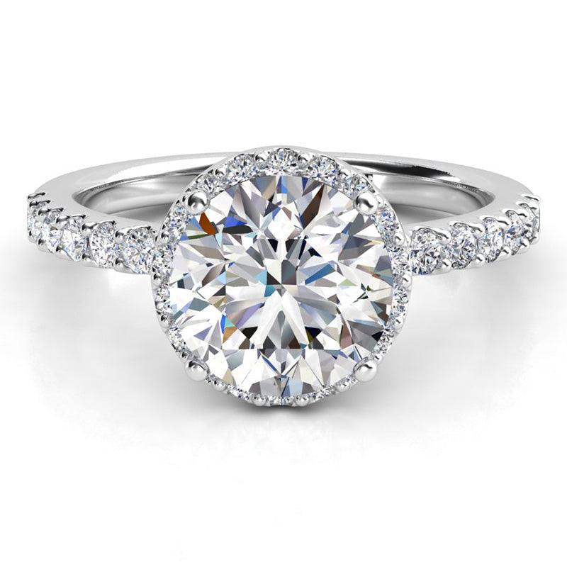 Orion - Unique diamond Halo Ring in platinum, with halo set just under main diamond and diamonds on the band