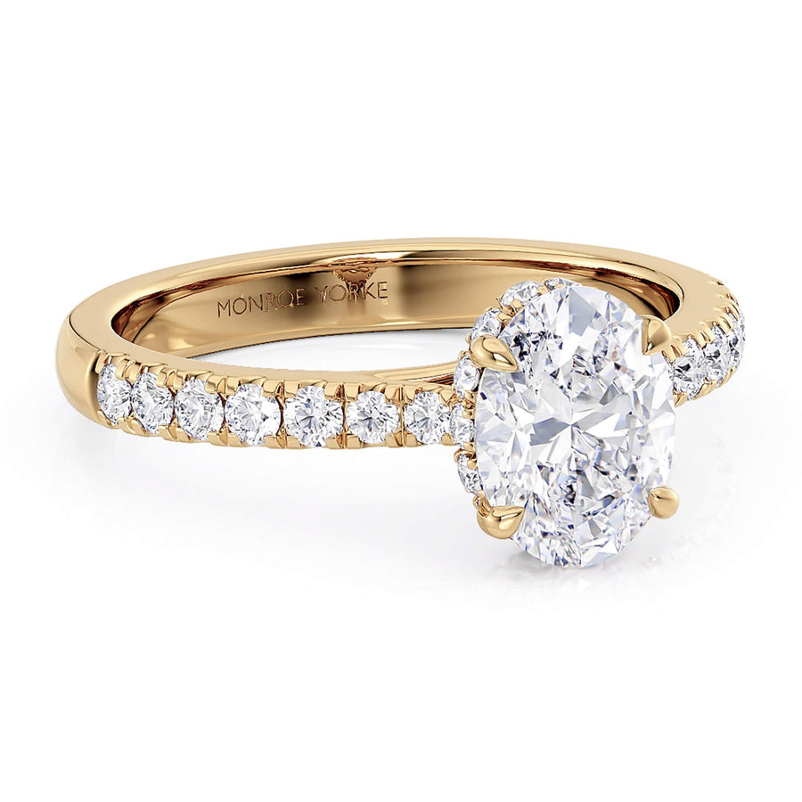 Side view of the Paige oval diamond engagement ring.  Band tapers into the centre setting. 