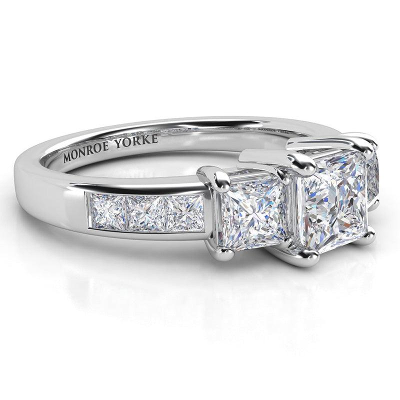 Robina - three stone ring - side view showing the beautiful setting and channel set princess cut diamonds. 