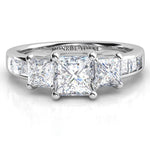 Robina in platinum.  Princess / square cut diamond trilogy ring.  